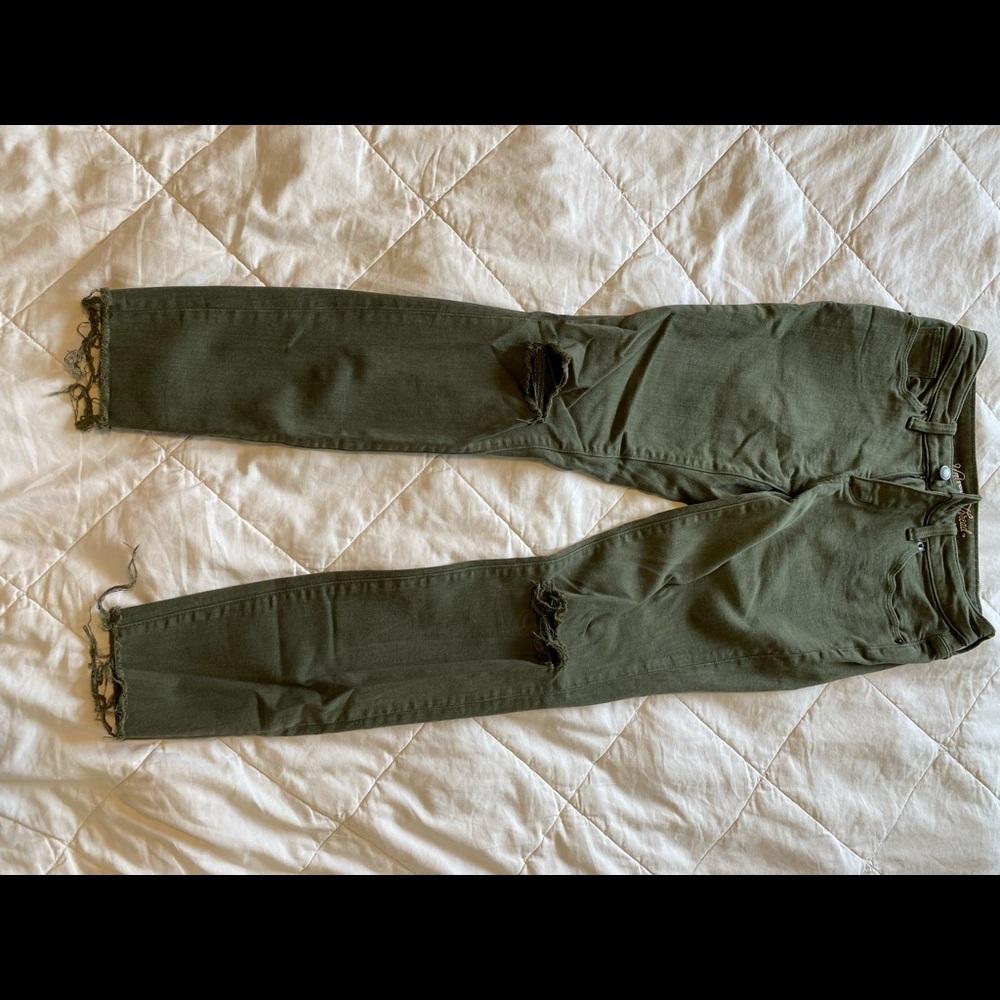 Green distressed ripped jeans